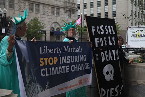Climate activists protest Liberty Mutual's business with the fossil fuel industry