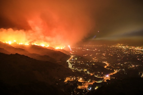 Californians evacuate as massive wildfire spreads