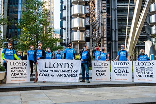 Returning Lloyd's of London professionals meet climate protest