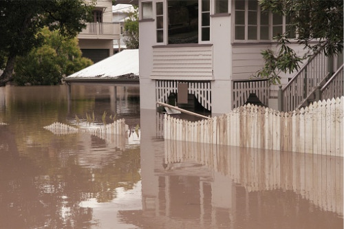 What steps can property owners take to mitigate flood exposure?