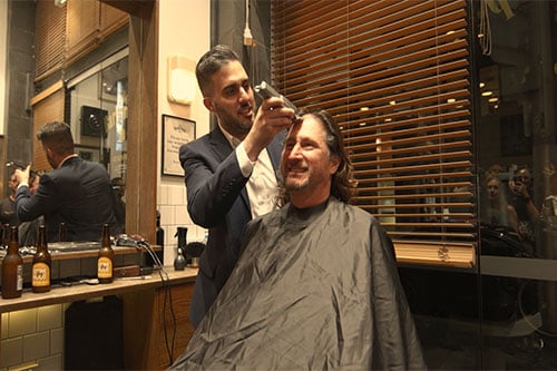 CEO raises $65k with charity head shave