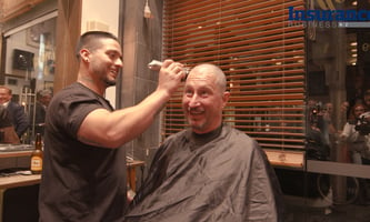 CEO raises $70K with charity head shave