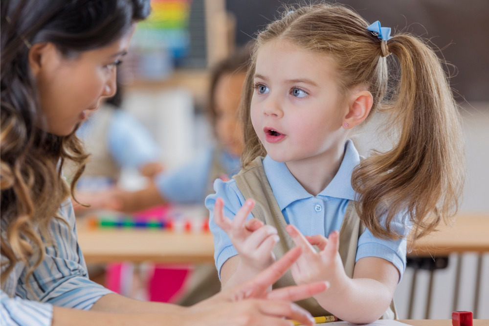 kindergarten students talking to each other