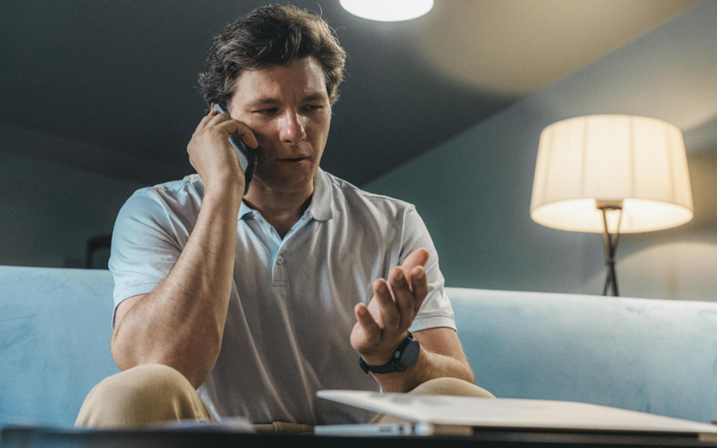 an on-call employee answers his phone at night while at home