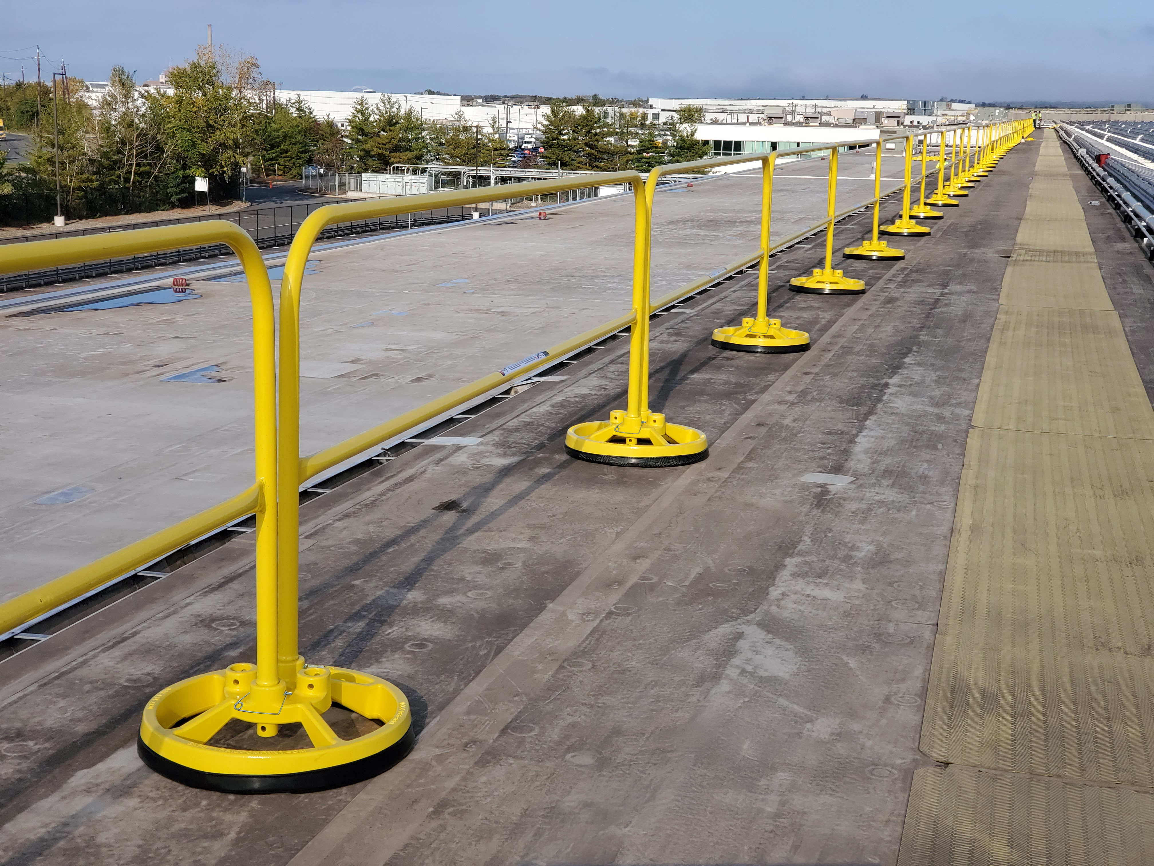 Non Penetrating Railing OSCO Safety expands non-penetrating rooftop railing system | Canadian ...