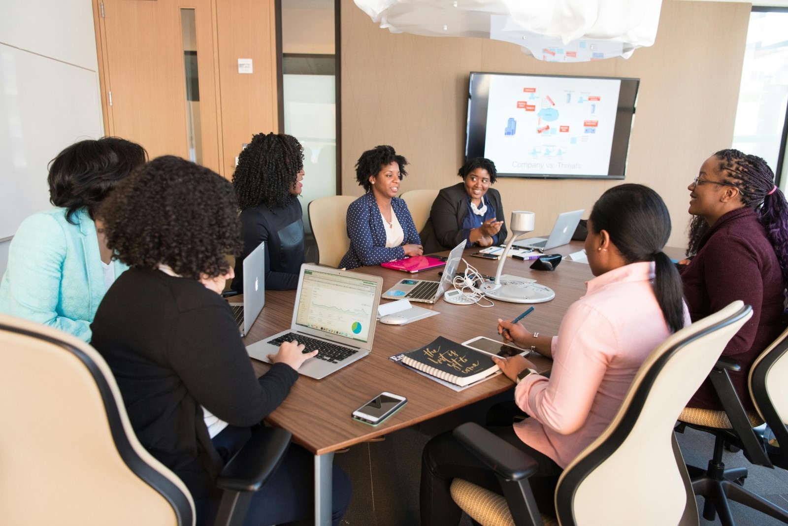 employees discussing benefits at a meeting