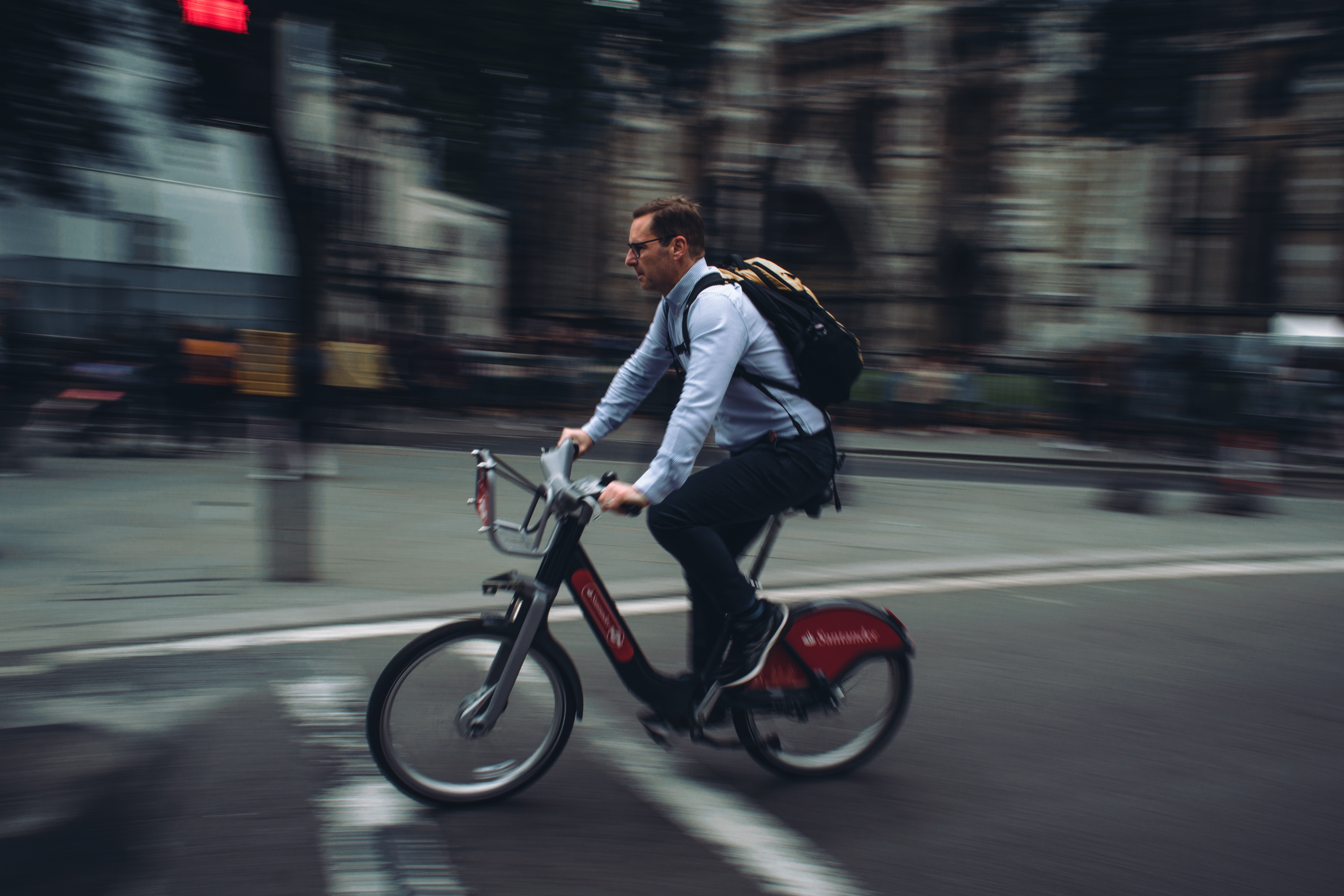 male office employee cycling to work