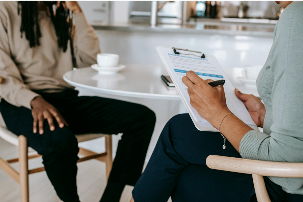 a hiring manager uses a standardized form to interview a Black applicant 