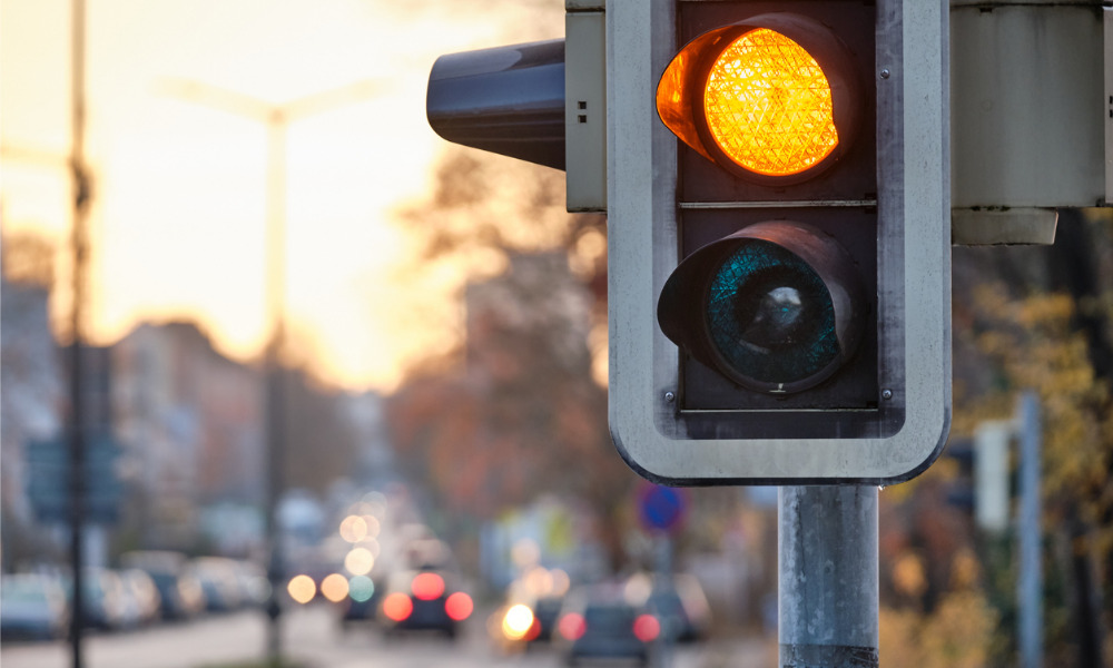 New Zealand calls time on COVID-19 traffic light system
