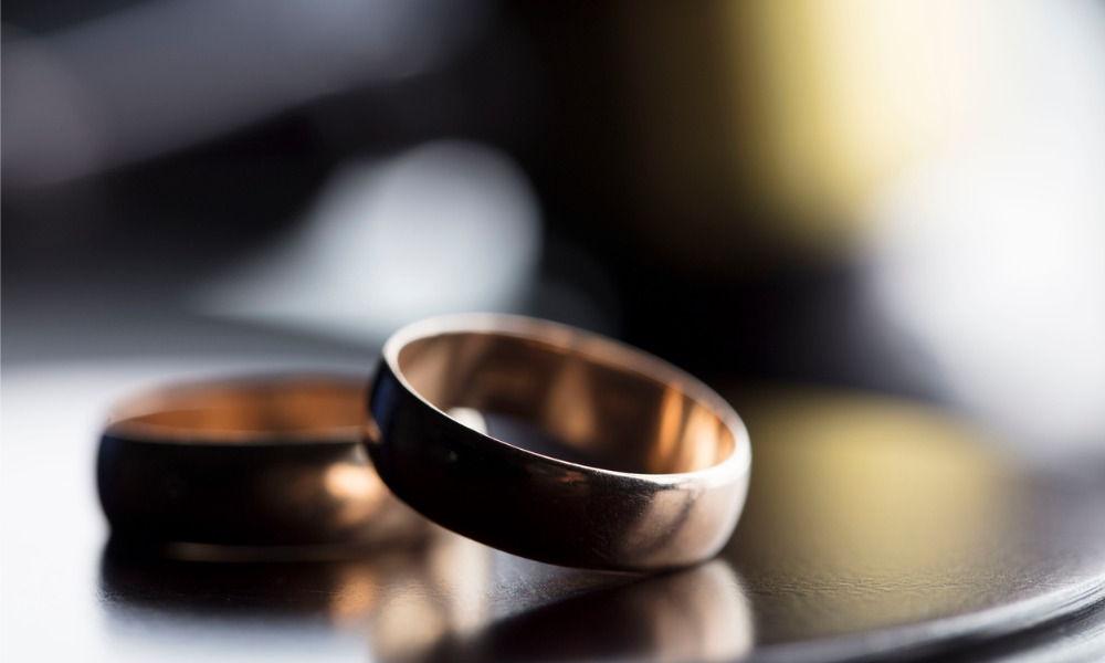 Can HR fire one half of a divorced couple?