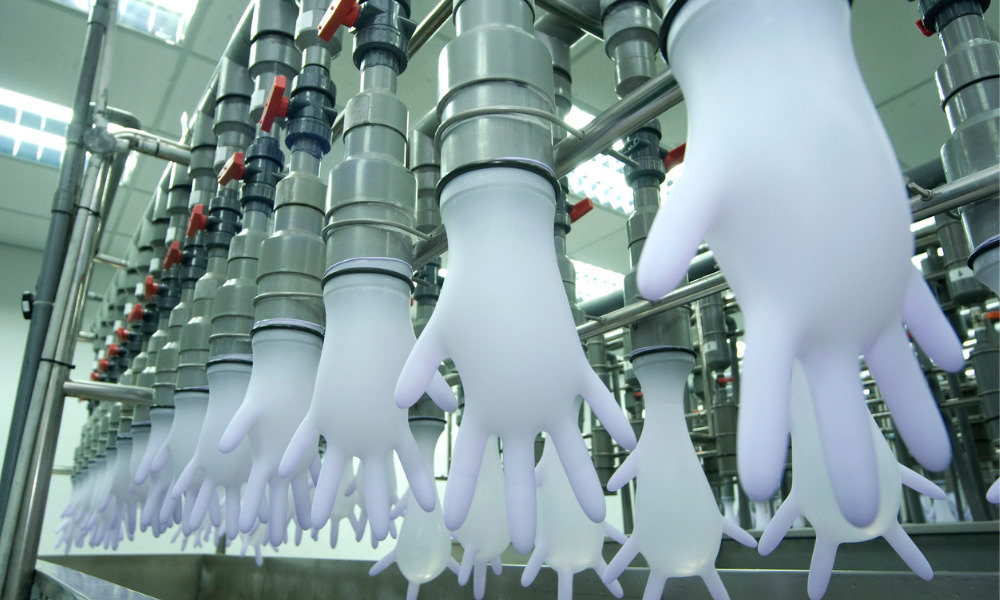 Thousands at rubber glove factory test positive for COVID-19