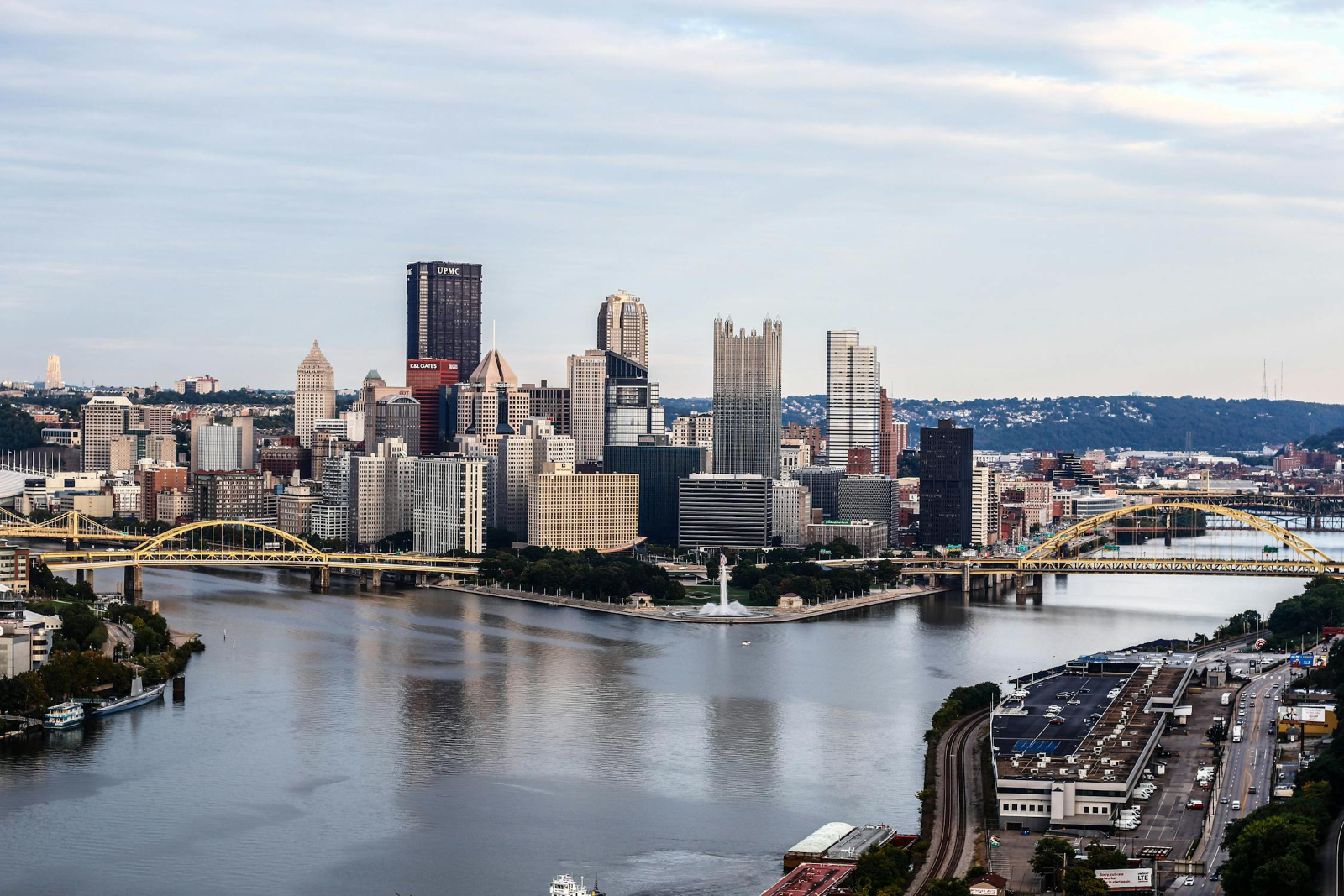  towering buildings, wide roads, and the city bridge in Pittsburgh, Pennsylvania