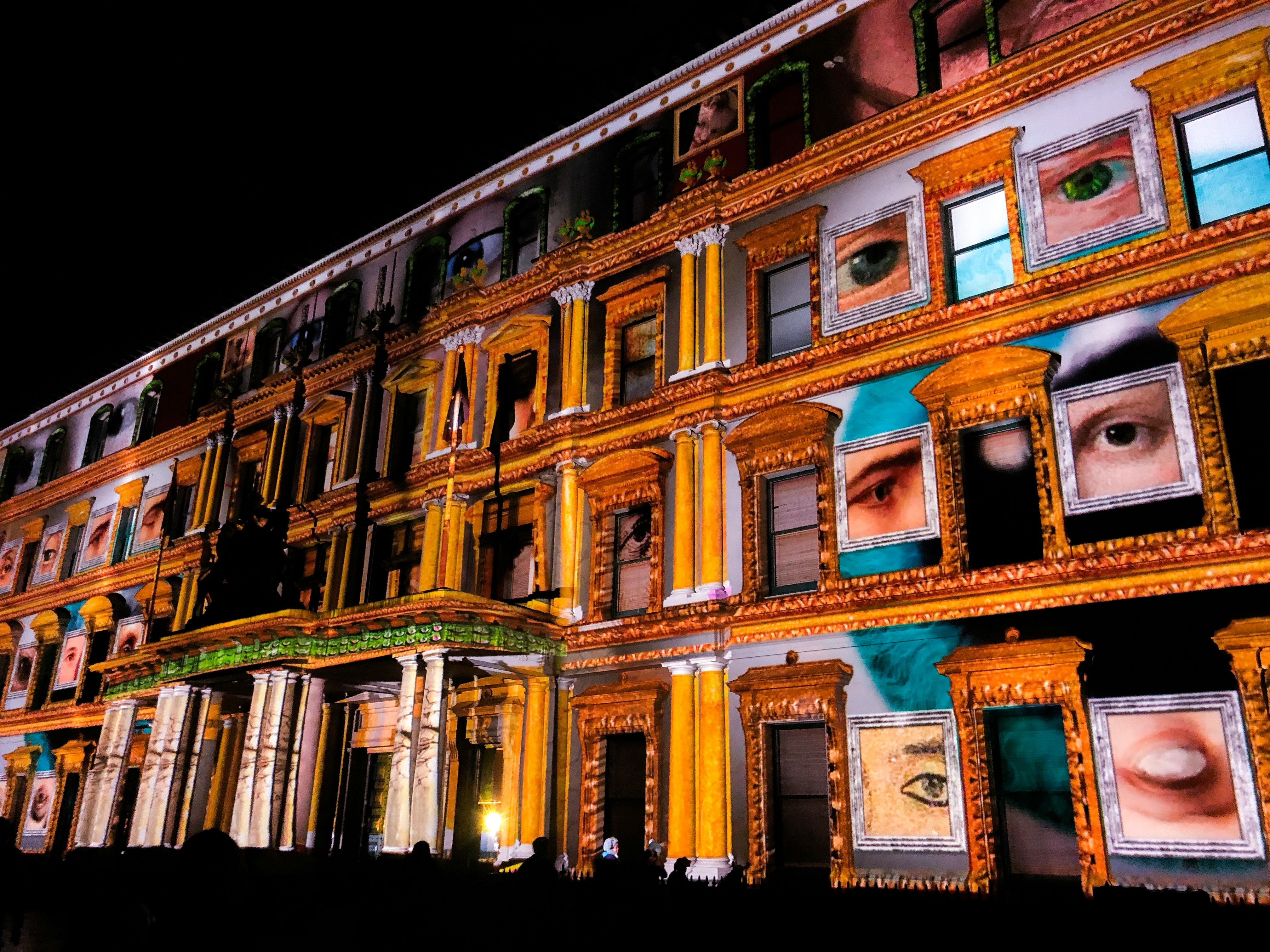  a colourful design is projected on the facade of an historic building as part of White Night Melbourne