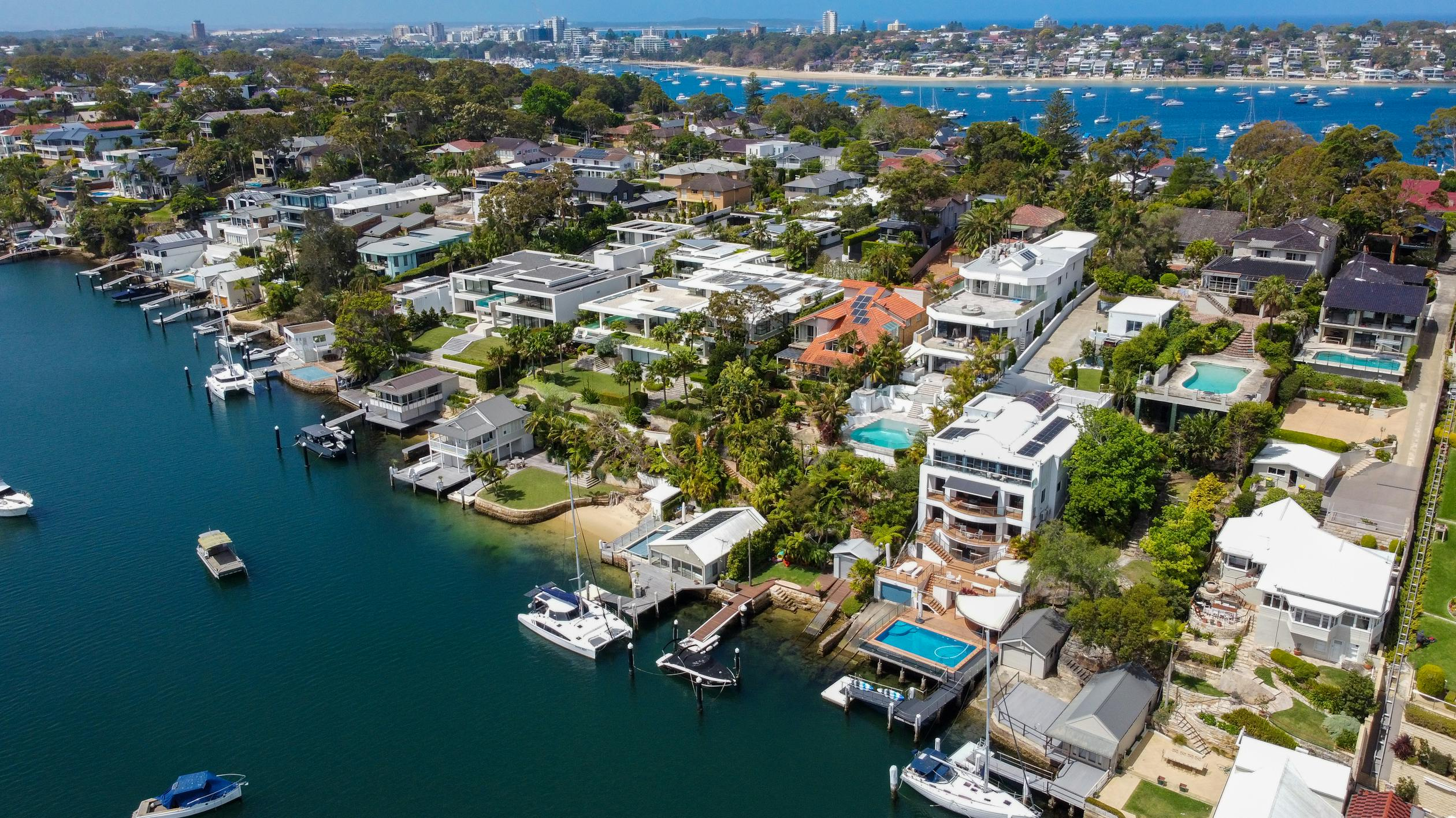  aerial shot of what might be owner-occupancy or rental homes along the water in Burraneer, Sydney