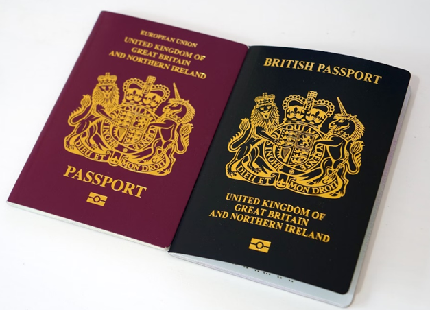 the new British passport, an identification document accepted by Coventry for Intermediaries, side-by-side with the old European Union passport on a white table