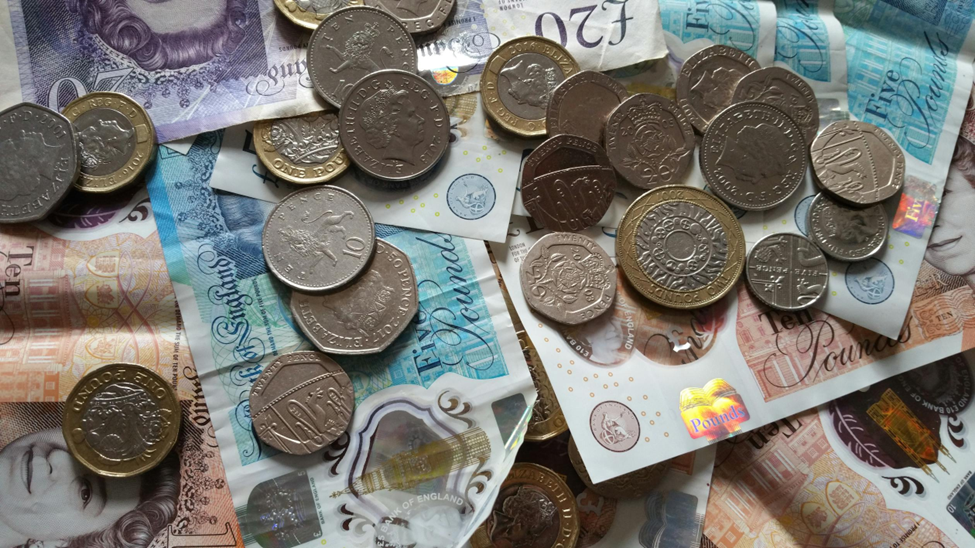  a close-up of British pound sterling notes and coins symbolising income for potential borrowers of Principality for intermediaries